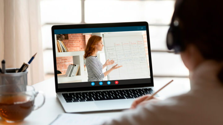 big-brain-learning-adult-online-lesson Student having an online English lesson with a native tutor